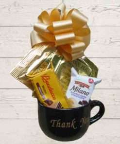 Gifts Under $50 That Will Make You Look Like a Hero 12 Black Thank You Mug filled with cocoa, coffee & cookies