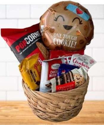 One Tough Cookie gift basket with snacks and One Tough Cookie balloon