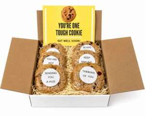 gift box with gourmet cookies with inspirational message and large card that says "You're One Tough Cookie"