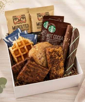 Gift box filled with coffees, cocoa, and gourmet foods