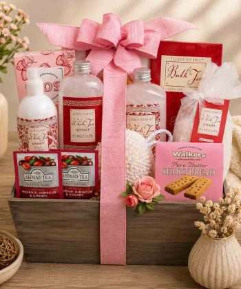 White Tea and Ginger spa gift basket with bath products, herbal tea, shortbread cookies, bath puff, and reusable wooden crate